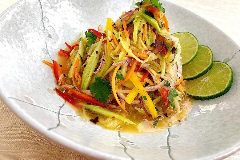 Toss the chayote salad in a spicy coconut oil and coriander dressing.