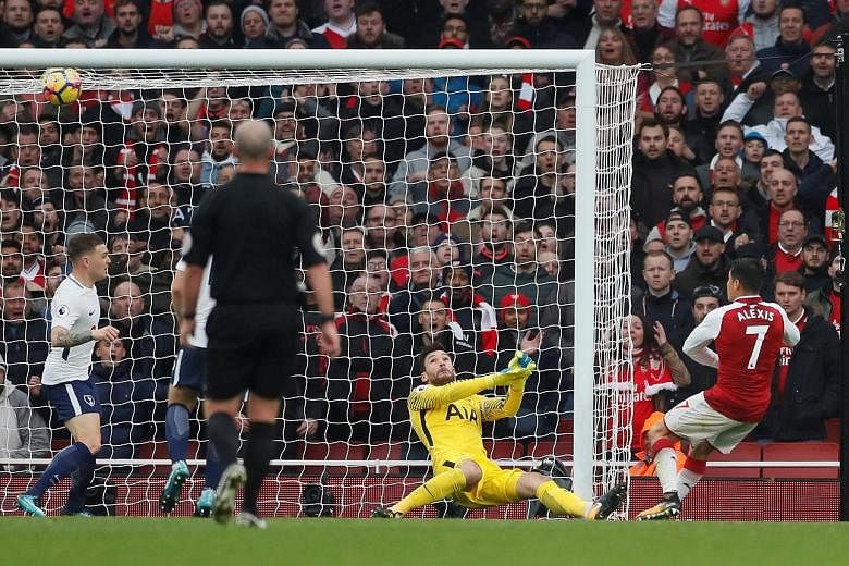 Alexis Sanchez rifling the ball past Hugo Lloris into the roof of the Spurs net to make it 2-0 to Arsenal.