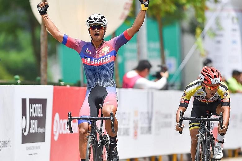 A jubilant Ronald Oranza crossing the finish line to seal victory for the Philippines at the OCBC Cycle Speedway South-east Asia Championship yesterday.