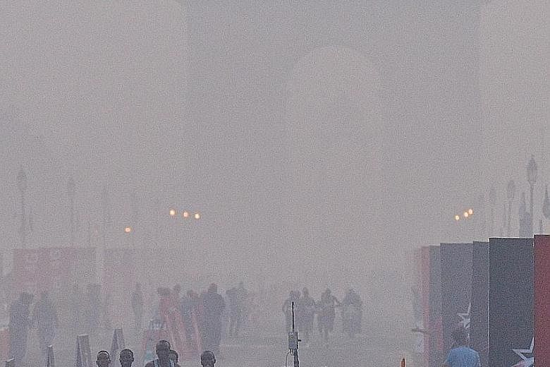 Runners taking part in last year's Delhi Half Marathon in the Indian capital. This year's run is going on as planned today, despite suggestions that it should be cancelled.