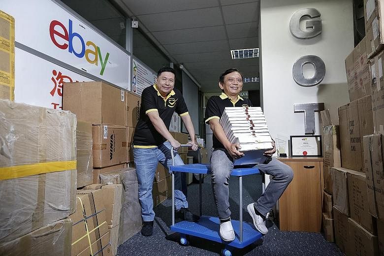 Watch retailer Gift Time, whose founders are Mr Jason See (far left) and Mr Jeson Wu, is one of the top-performing cross-border-trade sellers on eBay in Singapore. Its top markets are Europe, the US and Australia, which helped the company to make abo