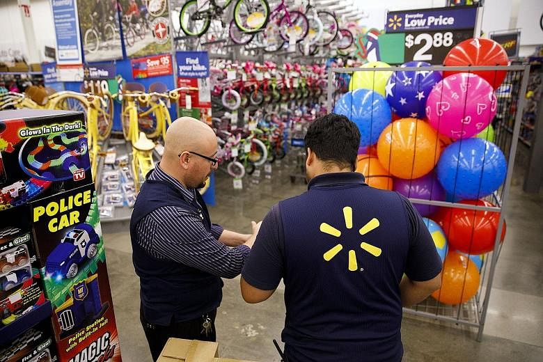 Walmart employees at a store in Burbank, California. Black Friday, the day after Thanksgiving Day on Nov 23 this year, traditionally marks the start of the US holiday shopping season - a critical time for retailers.