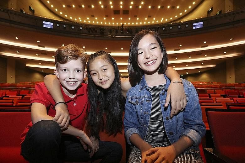 Playing the von Trapp children are (from far left) Max Makatsaria, Samantha Lee and Chloe Choo.