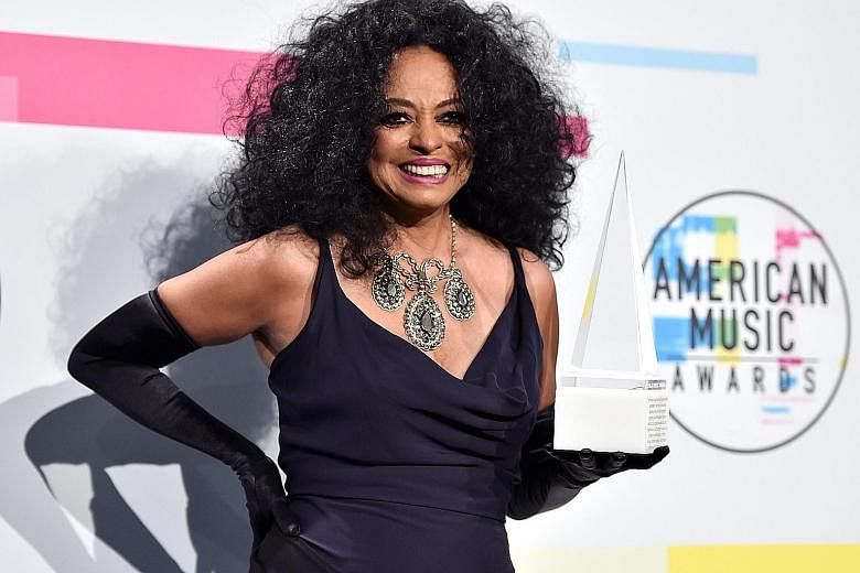 Other performers at the awards show included Diana Ross (above left) and Selena Gomez (above). South Korean boyband BTS performing at the American Music Awards in Los Angeles, California, on Sunday.