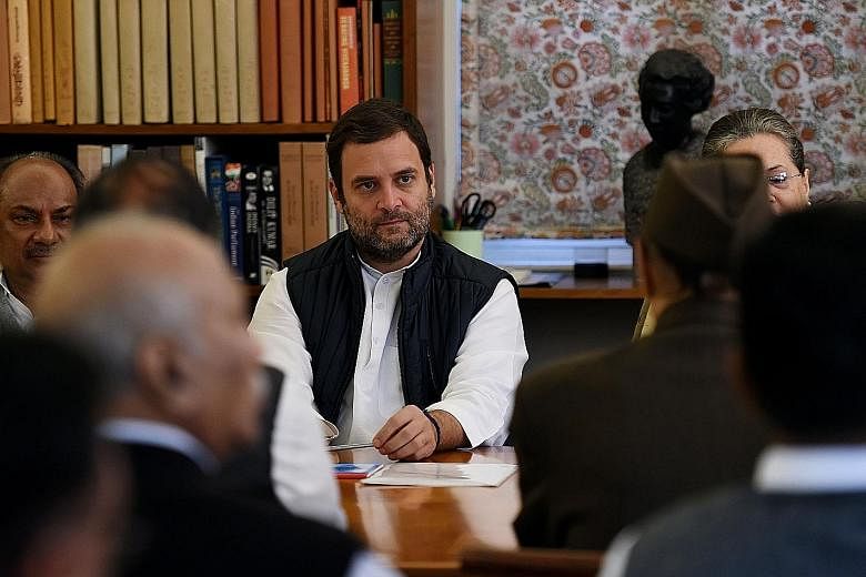 India's Congress party vice-president Rahul Gandhi (centre) at a working committee meeting at the party's headquarters in New Delhi yesterday. His elevation to the post of president is expected to be a mere formality as he has already been running Co