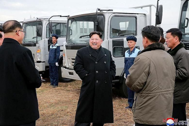 North Korean leader Kim Jong Un at the Sungri Motor Complex in South Pyongan province recently. With the US' designation of the North as a state sponsor of terror, companies or states that engage in business transactions with Pyongyang may face finan