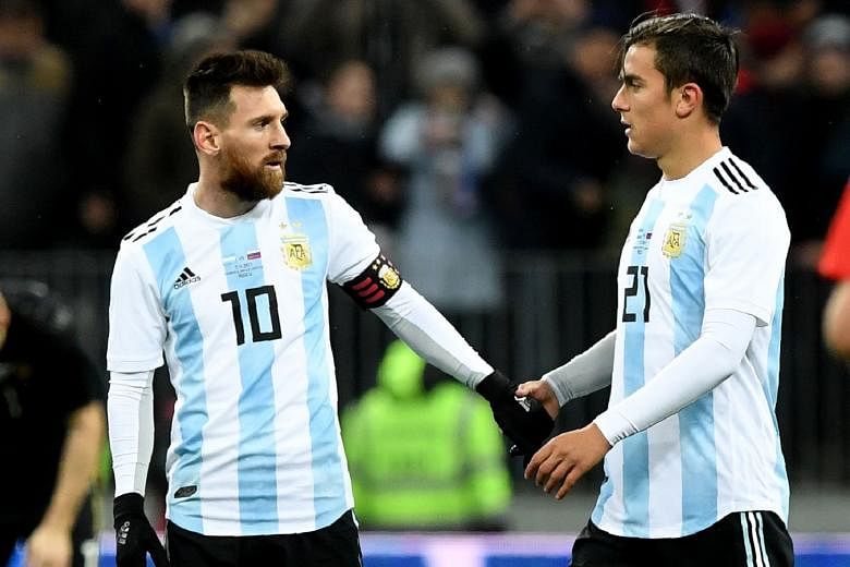 Paulo Dybala (right) names compatriot Lionel Messi as his source of inspiration, but says he wants to improve his own game to win trophies.