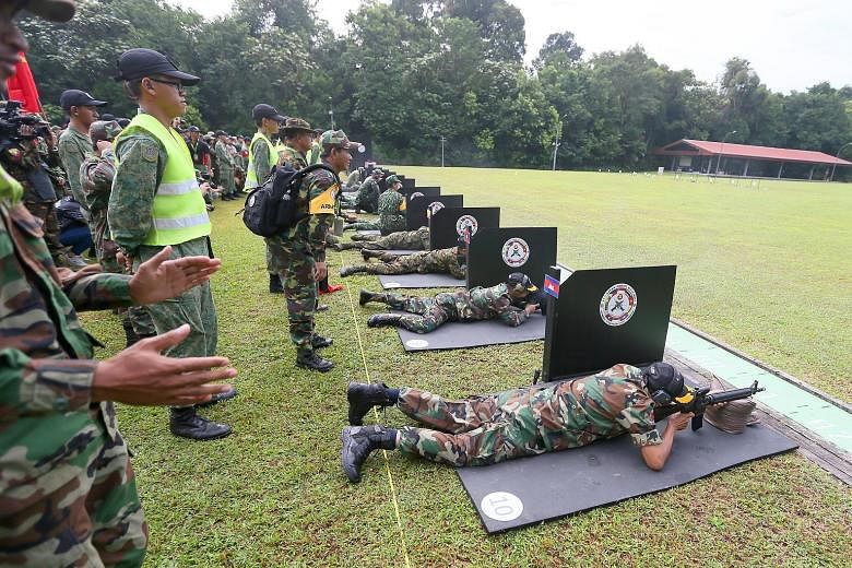 SAF soldiers performing part of their close combat training as one of the performance items for yesterday's Asean Armies Rifle Meet (AARM) closing ceremony. AARM is an annual event that aims to deepen military ties in the region through a rifle compe