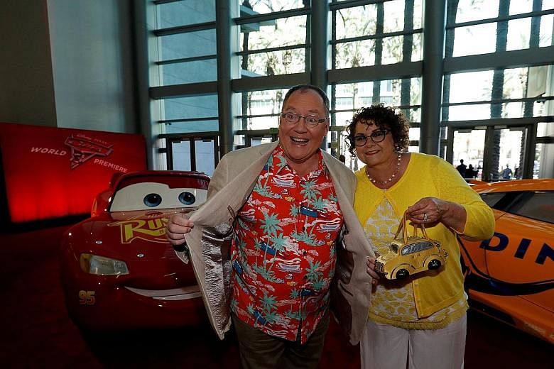Mr John Lasseter and his wife, Nancy, at the premiere of Cars 3 at the convention centre in Anaheim, California, on June 10. Mr Lasseter has an exuberant public image. At events for Disney fans, he often bounds onto the stage wearing a Hawaiian shirt