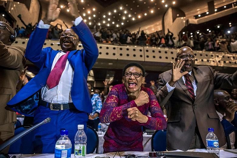 Zimbabwe's Members of Parliament celebrating after President Robert Mugabe announced his resignation on Tuesday in Harare. The announcement came after days of mounting pressure on the 93-year-old leader, whose long and authoritarian rule made him fea