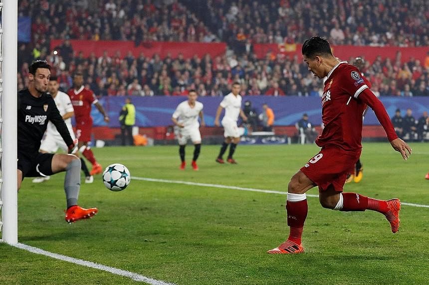Liverpool's Roberto Firmino, Georginio Wijnaldum and captain Jordan Henderson looking on in dismay after their 3-3 draw at Sevilla on Tuesday. Left: Firmino scoring the first of his brace, only for his side to be pegged back despite a three-goal lead