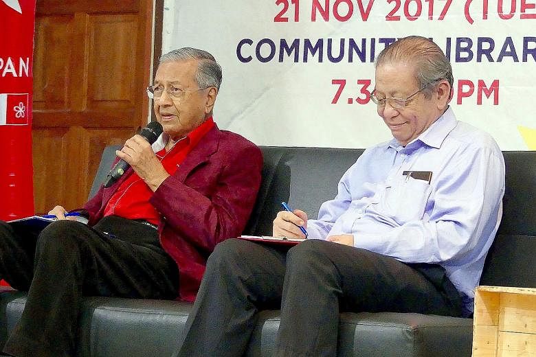 Political foes turned allies Mahathir Mohamad and Lim Kit Siang sharing a sofa at Harapan's "WhatSayYouth" town hall in Petaling Jaya on Tuesday.