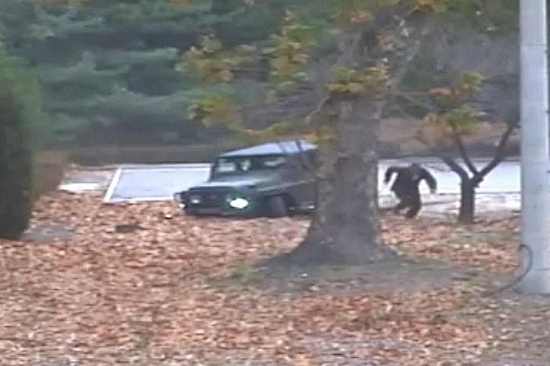 2 THE CHASE The defector is pursued by North Korean soldiers, with their weapons drawn and firing. 3 THE WOUNDED The soldier, having been shot at least four times by his former comrades, lies injured on the ground. 4 THE RESCUE He is later pulled to 