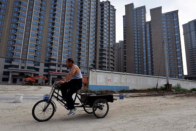 A housing complex under construction in Beijing. The capital, along with 11 other major cities, including Shanghai and Guangzhou, were selected in July to start pilot programmes to build rental housing projects.
