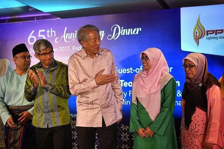 Deputy Prime Minister Teo Chee Hean and Minister-in-charge of Muslim Affairs Yaacob Ibrahim, with (from left) PPIS chief executive Mohd Ali Mahmood, PPIS president Rahayu Mohamad and PPIS adviser Fatimah Azimullah, at PPIS' 65th anniversary gala dinn