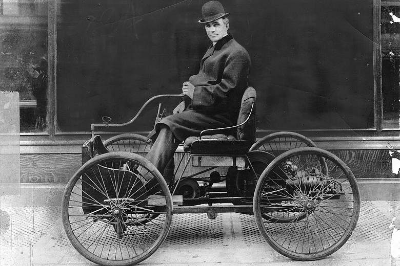 Henry Ford in his first car, the Ford Quadricycle. His Ford Model T cost US$825 in 1908. As demand shot up, the price fell by almost half, enabling a whole generation of people to drive. He also astonished the market when he doubled the salary of his