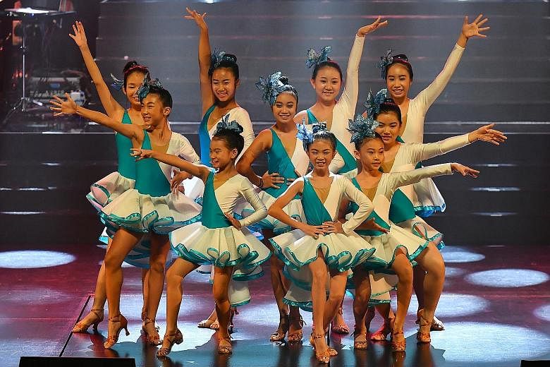 Young performers (first row, from left) Laura Maurer-Stroh and Aadeetiya Jayashanker, both aged 11; Estovan Cheah, seven; Cerilynn Law, 14; and Syah Rizuan Huslan, 12; (second row, from left) Mr Warren Fernandez, The Straits Times' editor and editor-