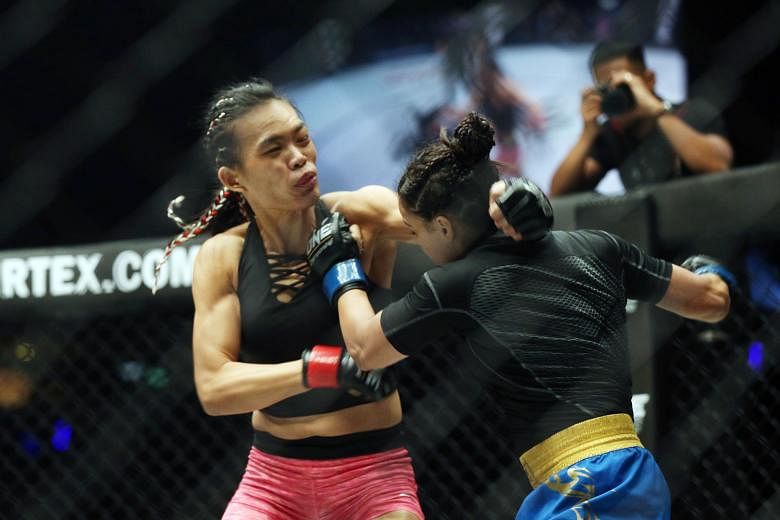 The One Championship women's strawweight bout between Tiffany Teo (left) and India's Puja Tomar last night lasted barely five minutes when Teo found her opening and locked Tomar in an armbar submission for the win.