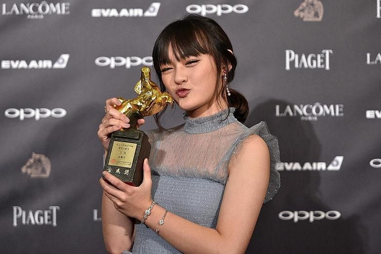 Taiwanese actress Vicky Chen with the Best Supporting Actress award at the Golden Horse Awards in Taipei yesterday.