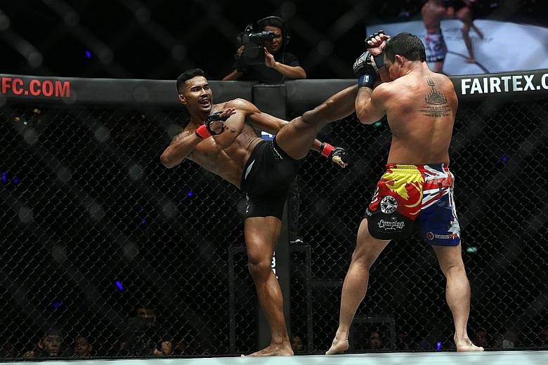 Singapore's Amir Khan landing a head kick on Australian Adrian Pang at One Championship's Immortal Pursuit event on Friday. He took his win-loss record to 9-2 with the win.