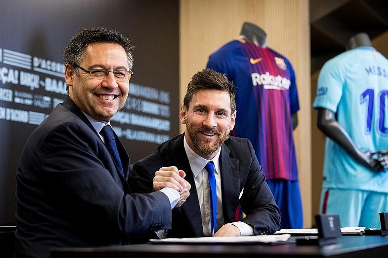 Lionel Messi and Barcelona president Josep Maria Bartomeu are all smiles after the Argentinian star inked a blockbuster four-year deal extension until 2021 with an eye-catching €700 million buyout clause.