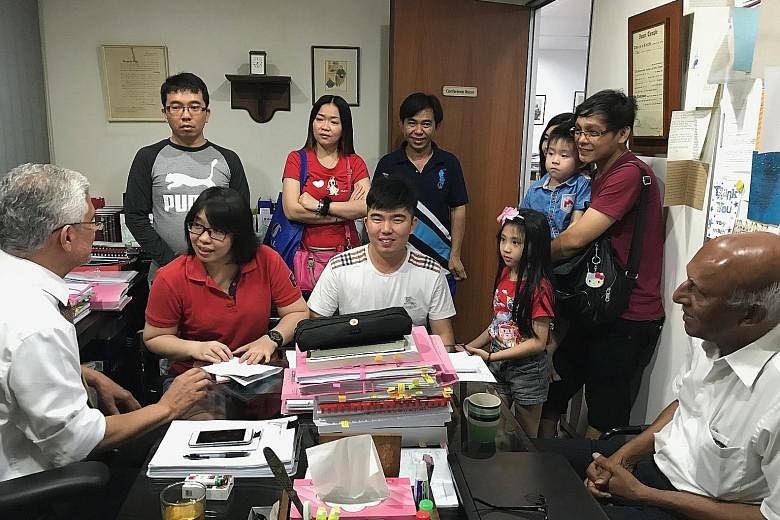 Ms Ting Swee Ling (in spectacles) with her lawyer Peter Fernando (far left) and her family members. The first thing that she did after being freed on Thursday was to head to Mr Fernando's office to thank him.