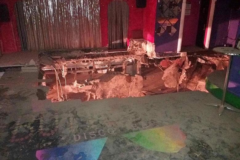 Twenty-two people were injured, mostly with broken bones and bruises, after part of the floor of a nightclub on Spain's holiday island of Tenerife collapsed early yesterday, causing them to plunge into the basement, local officials said. Emergency se