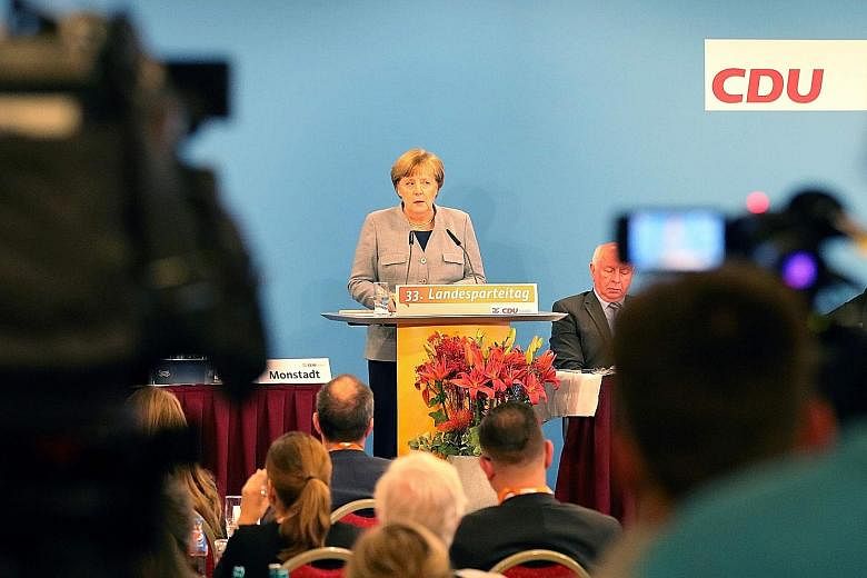 Dr Angela Merkel speaking at a regional Christian Democratic Union party conference on Saturday, in Kuehlungsborn, Germany, her first major speech since coalition talks collapsed.