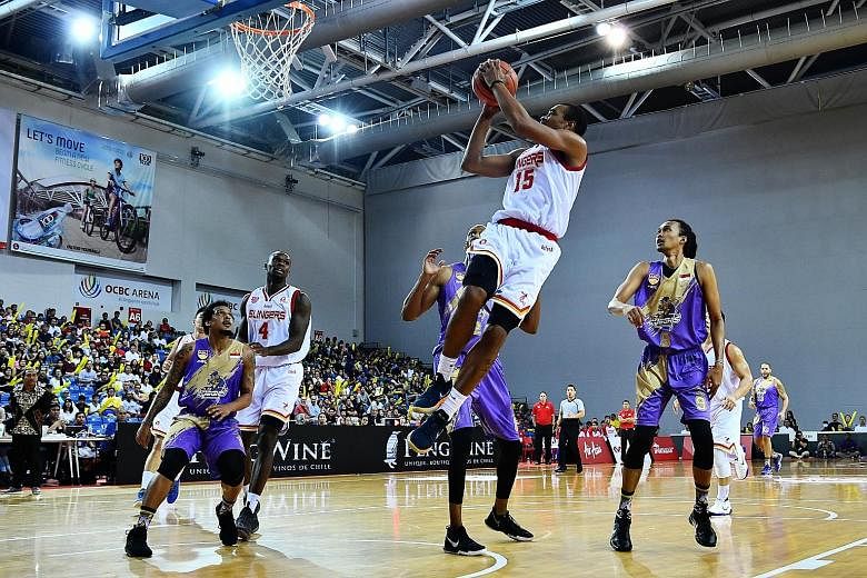 Singapore Slingers swingman Xavier Alexander jumps to shoot in the Asean Basketball League match against CLS Knights Indonesia at the OCBC Arena yesterday. Alexander posted a game-high 27 points, nine rebounds and seven assists to lead the Slingers t