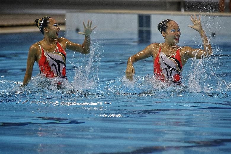 Singapore Swimming Association's Hannah Chiang (left) and Rachel Thean turning on the style to win the open duet free routine final on the last day of National Synchronised Swimming Championships.