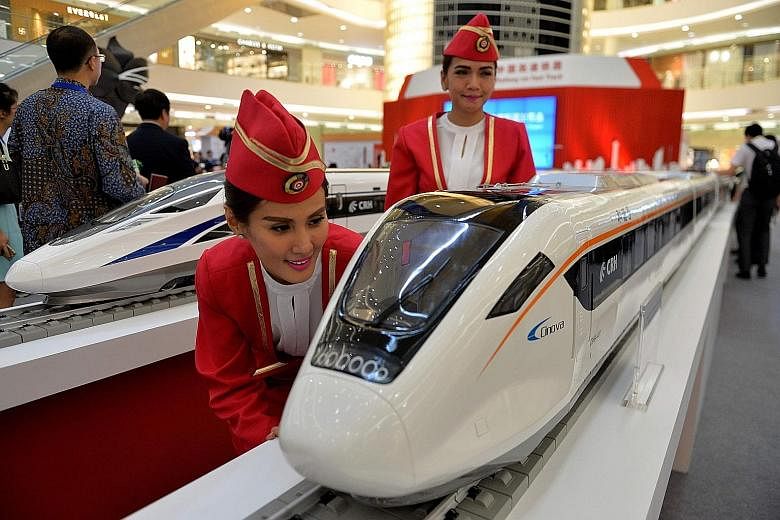 Scale models of bullet trains on display at a Jakarta mall. The buoyant investment climate has supported the economy as President Joko Widodo pushed to build more infrastructure across the country.