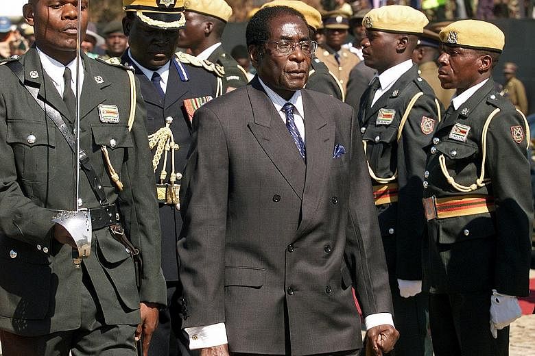 2003: An inspection of the presidential guard at the Heroes' Day ceremony in Harare.