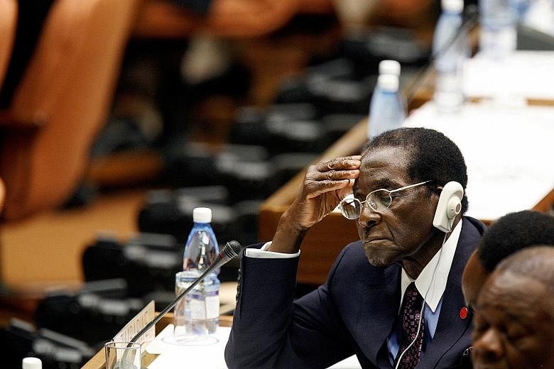2006: Mr Mugabe listening to the closing statement from then acting Cuban president Raul Castro at the summit for non-aligned nations in Havana, Cuba. 1980: As Zimbabwean prime minister then, Mr Robert Mugabe, who was also leader of the Zimbabwe Afri
