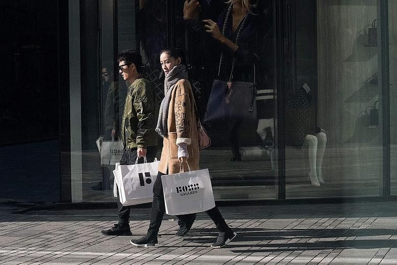 Shoppers in the popular Sanlitun district in Beijing. Consumption made up 64.7 per cent of China's gross domestic product growth last year, up from 44.9 per cent in 2010, and young people are the most active group of consumers in China today, says on