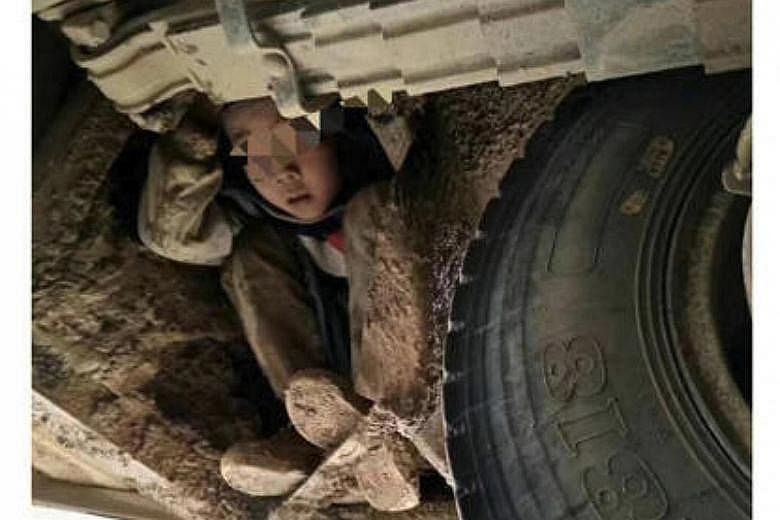 The boys from a rural village in Guangxi, who were reported missing by their teacher, were found clinging to the undercarriage of a bus. They were covered in mud but were unharmed although the bus had travelled across steep terrain for 5km of the 80k
