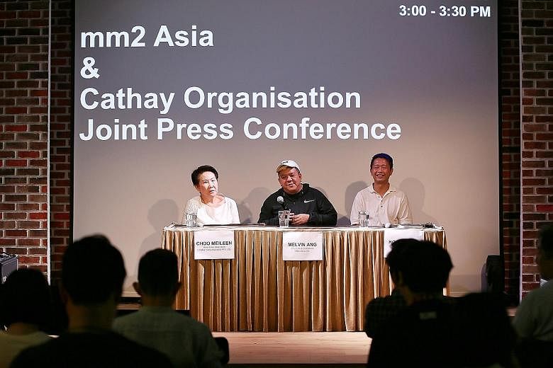 Cathay Organisation has sold only its cinema business and retains other assets, such as The Cathay building in Handy Road (above). Managing director of Cathay Organisation Choo Meileen and chief executive of mm2 Asia Melvin Ang (both left) at a press