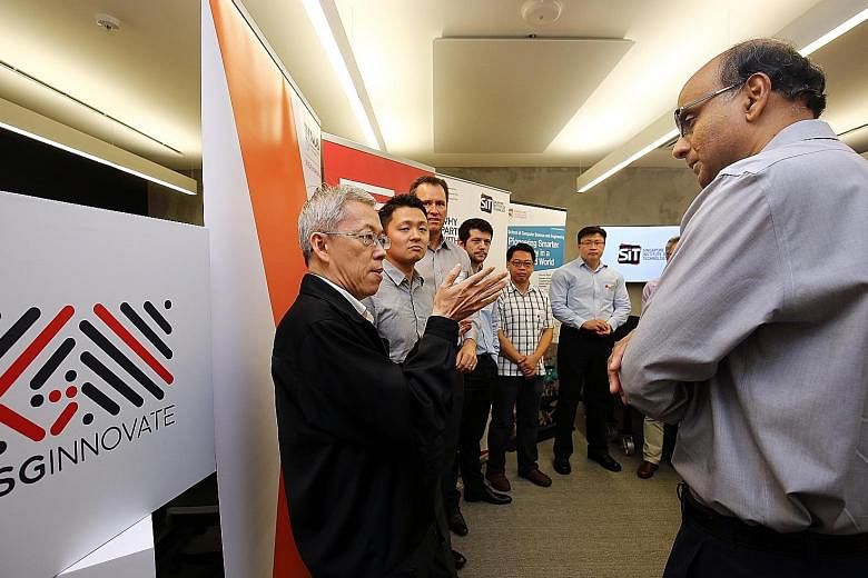 Deputy Prime Minister Tharman Shanmugaratnam with NUS Entrepreneurship Centre director Wong Poh Kam, who is also a professor at NUS Business School, and other SGInnovate partners at the launch of SGInnovate last year. SGInnovate will manage a part of