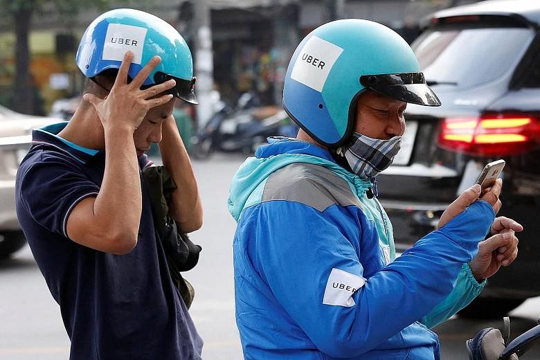 An Uber rider in Hanoi. While Uber has an office in nearly every country it operates in, including Singapore, it is not clear if local laws that require organisations to protect personal data apply to Uber.