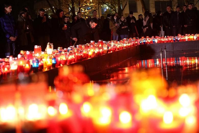 Croats lighting candles on Wednesday for war criminal Slobodan Praljak, who killed himself seconds after the UN war crimes tribunal at The Hague upheld his 20-year sentence.