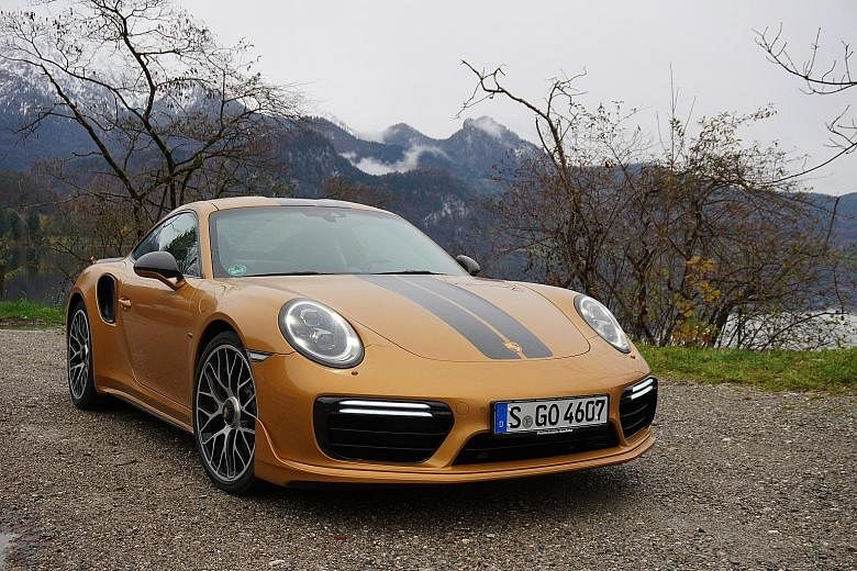 The 911 Turbo S Exclusive Series has a signature "Gold" paint job with stripes of exposed carbon-fibre woven in a glossy finish.