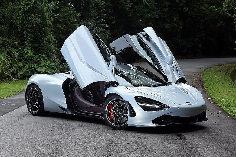 The McLaren 720S' flowing lines and leather-bound interior are a joy to behold. In Track mode, the car's rear spoiler rises.
