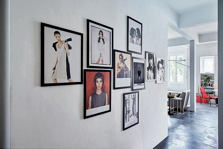 Concrete ledges double as seating (left) in the shophouse home of Mr Cheah Wei Chun (above). A wall (top), adorned with pictures of the celebrities, artists and models he has worked with, adds an interesting touch to the predominantly white and grey 