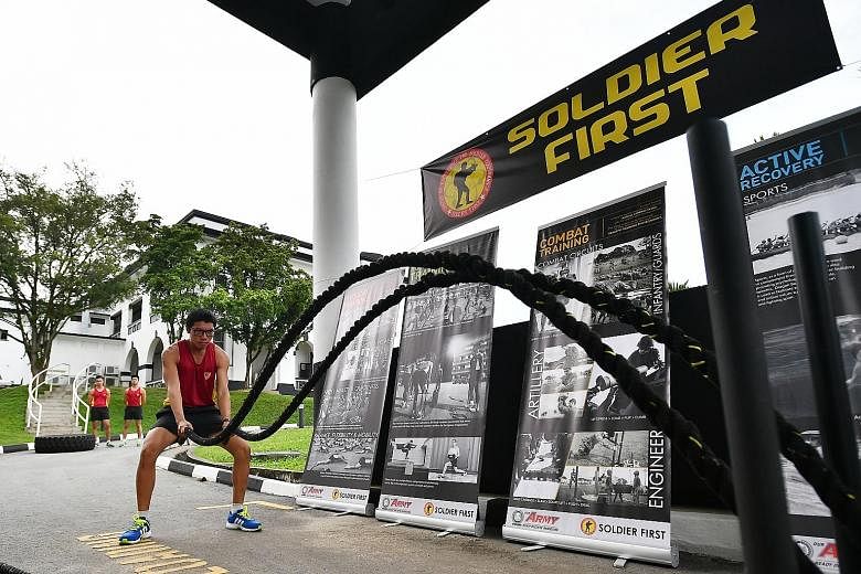 Third Sergeant Rashid Mustaffa, 22, training with battle ropes at the Centre of Excellence for Soldier Performance in Selarang Camp during a media preview on Tuesday.