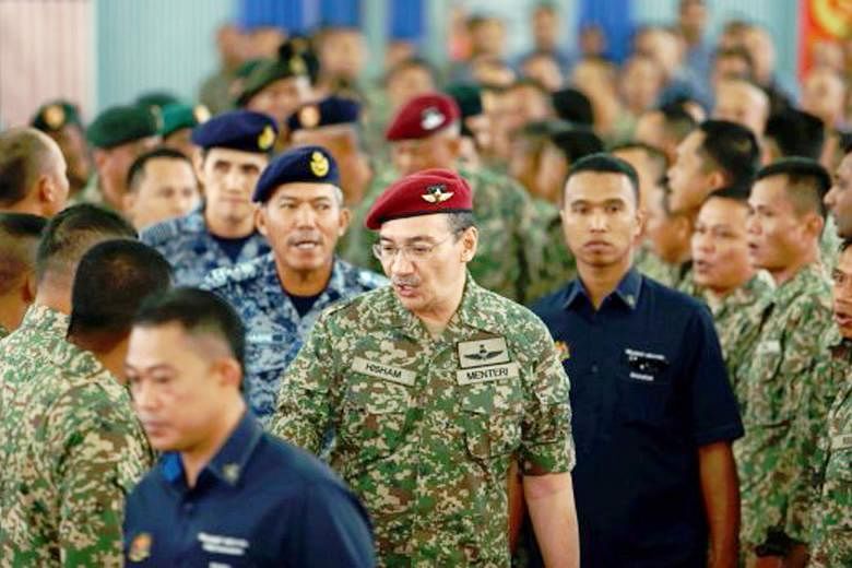 Malaysian Defence Minister Hishammuddin Hussein's (centre) defence duties have given him access to the international stage, and he has made his work relevant to contemporary issues like militancy and terrorism.
