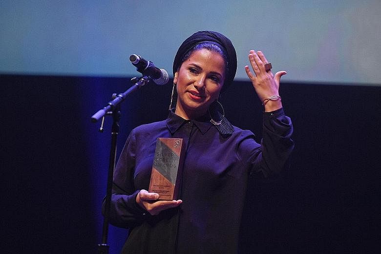 Screenwriter Farnoosh Samadi collecting the award for Iranian movie Disappearance (Napadid Shodan) by Ali Asgari, which won the top accolade of Best Film in the Asian Feature Film category. Actress Sadaf Asgari won the Best Performance award.