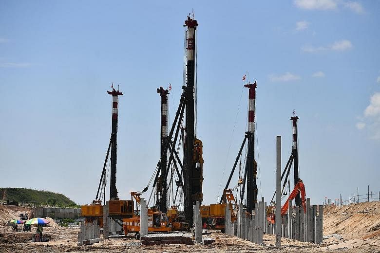 Piling work in progress. By the time construction and other works are completed around 2030, Changi Airport will have almost doubled to cover over 2,000ha. A machine sieving soil to ensure that the right quality of soil goes into the construction of 