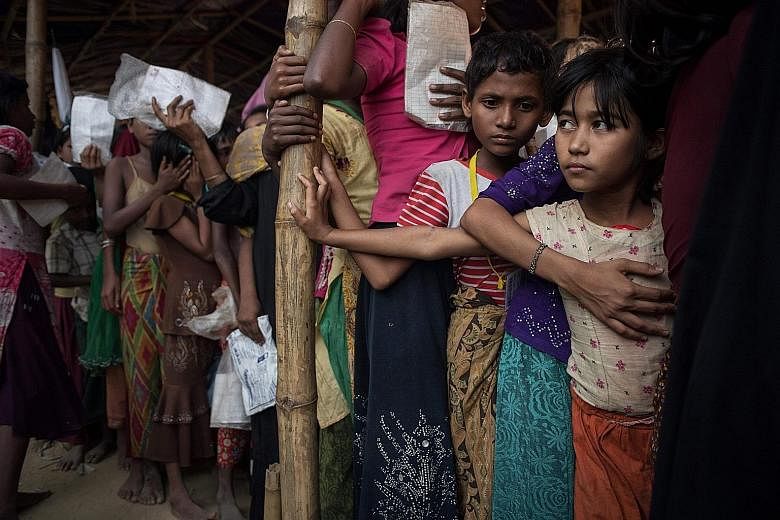 Rohingya migrants at Balukhali refugee camp in Cox's Bazar last Thursday. Within Myanmar, the word "Rohingya" resembles a fuse to a bomb. It sets people off.