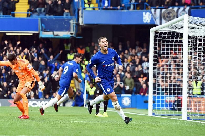 Eden Hazard sticking out his tongue after scoring Chelsea's 21st-minute equaliser against Newcastle United yesterday. He later scored his second goal from the penalty spot.