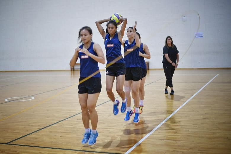 Singapore co-vice captain Nurul Baizura (with ball) and her team-mates training as coach Natalie Milicich draws the rope.