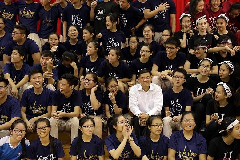 As children get older, it is important to give them space to grow up and manage tasks independently, says Mr Kwek Hiok Chuang, seen here with students and alumni of Nanyang Junior College at a farewell event on his retirement last year.